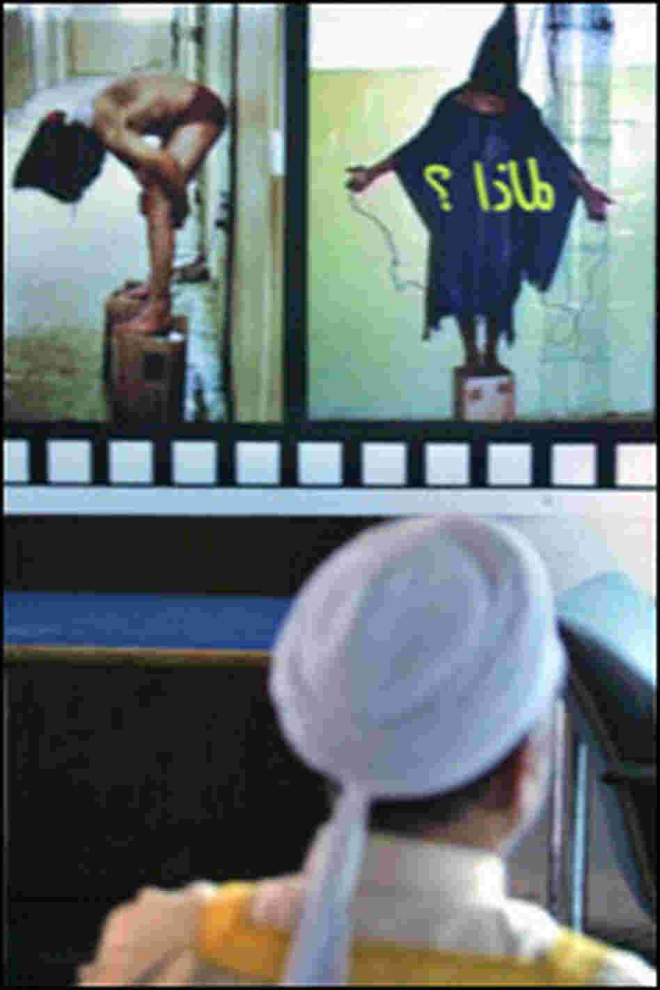 An Iraqi man looks at photos of prisoners. Credit: Karim Sahib/AFP/Getty Images.