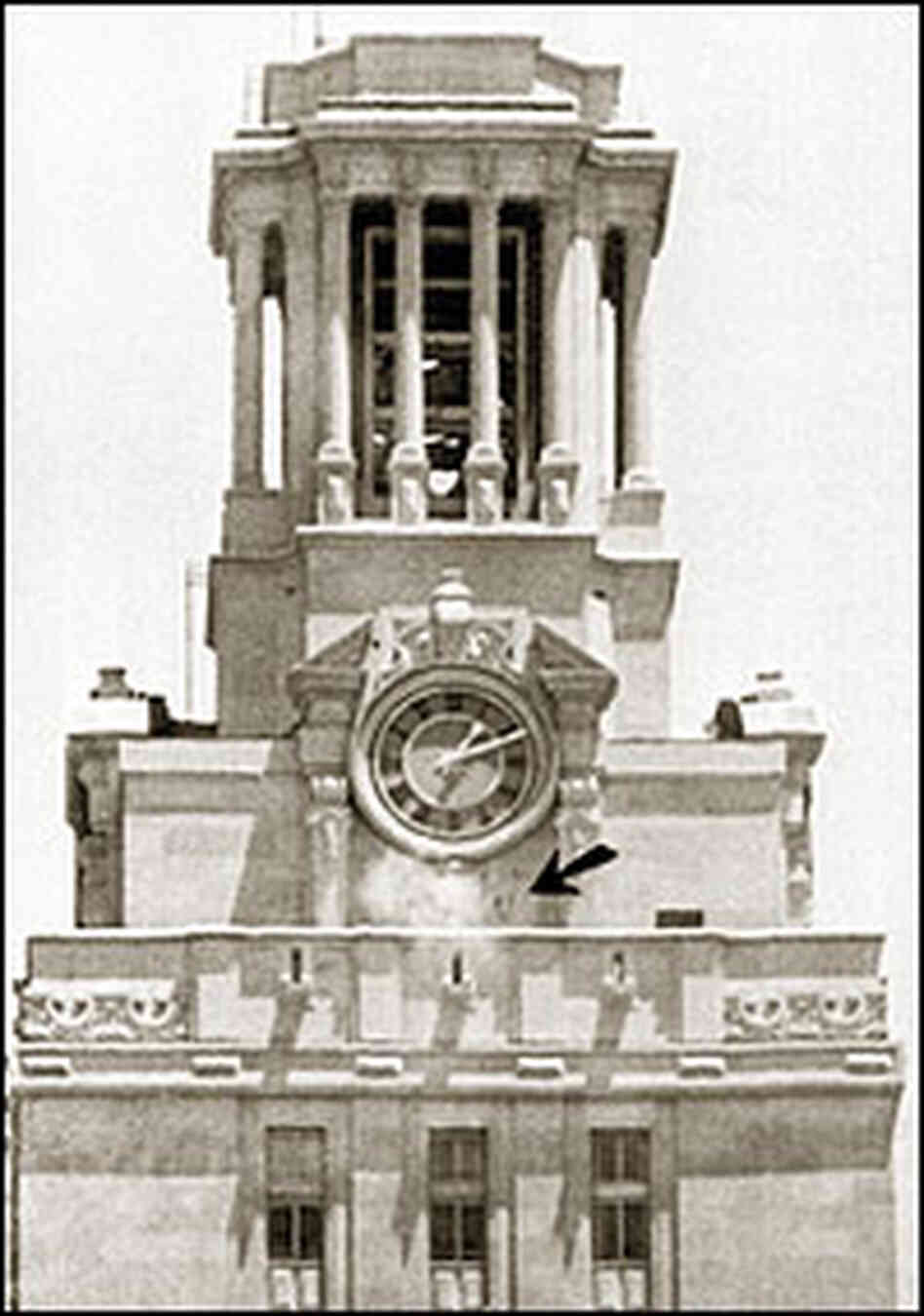Police bullets kick up dust around the clock on the University of Texas tower.