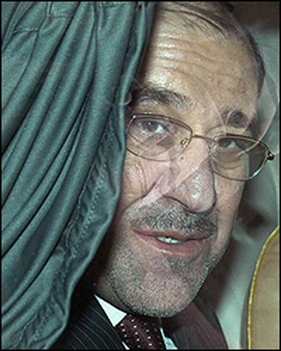 Iraqi Prime Minister Nouri al-Maliki, seen through a car window on a visit to Kuwait Tuesday. Iraqi Prime Minister Nouri al-Maliki, seen through a car window on a visit to Kuwait Tuesday.