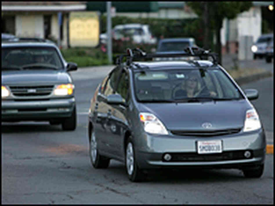 A Toyota Prius hybrid is seen driving down the street in San Anselmo, Calif. A Toyota Prius hybrid is seen driving down the street in San Anselmo, Calif.