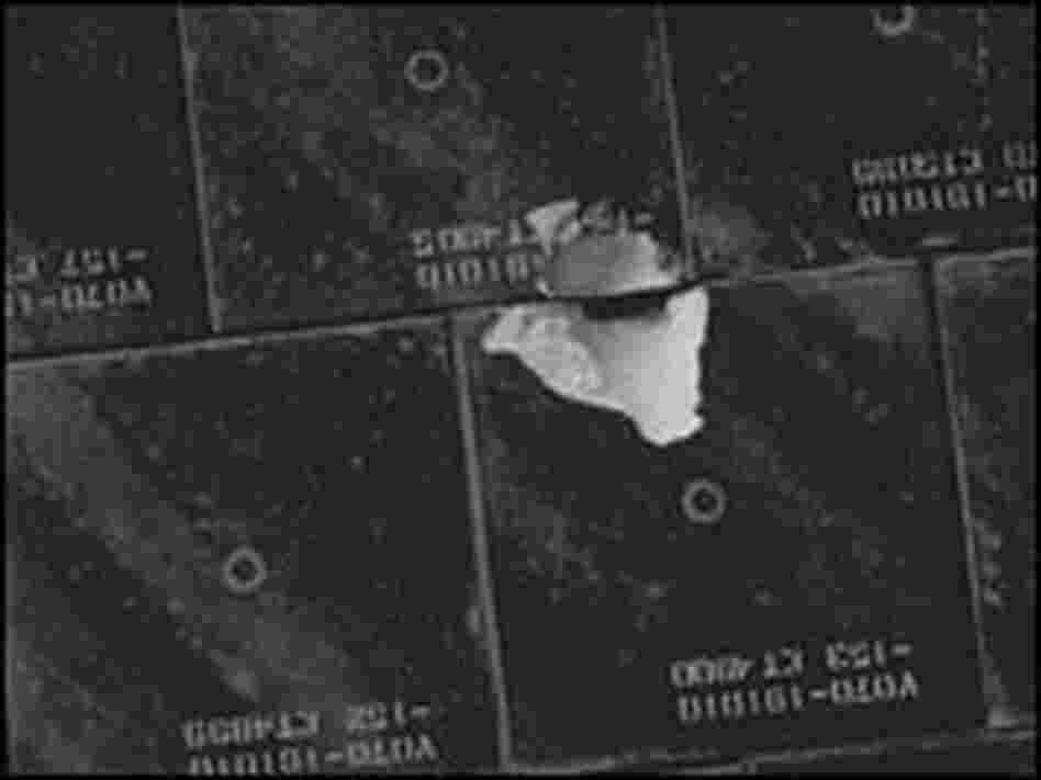 Close up of damaged tile on underbelly of Space Shuttle Endeavour