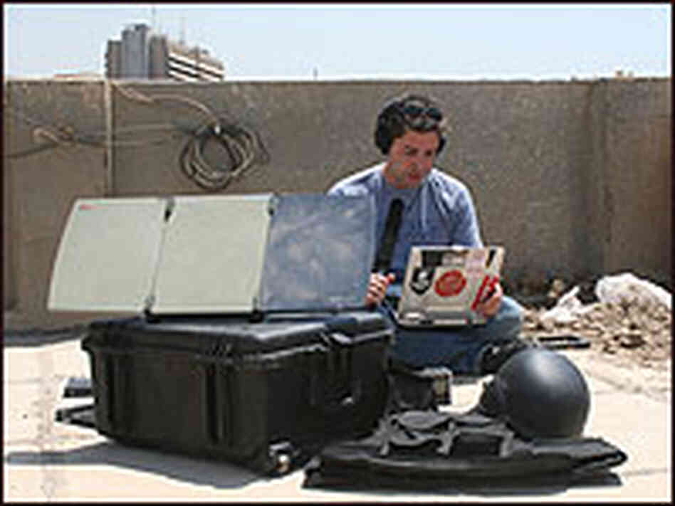 Tom Bullock files a piece from a roof in Baghdad in 2007. Tom Bullock files a piece from a roof in Baghdad in 2007.