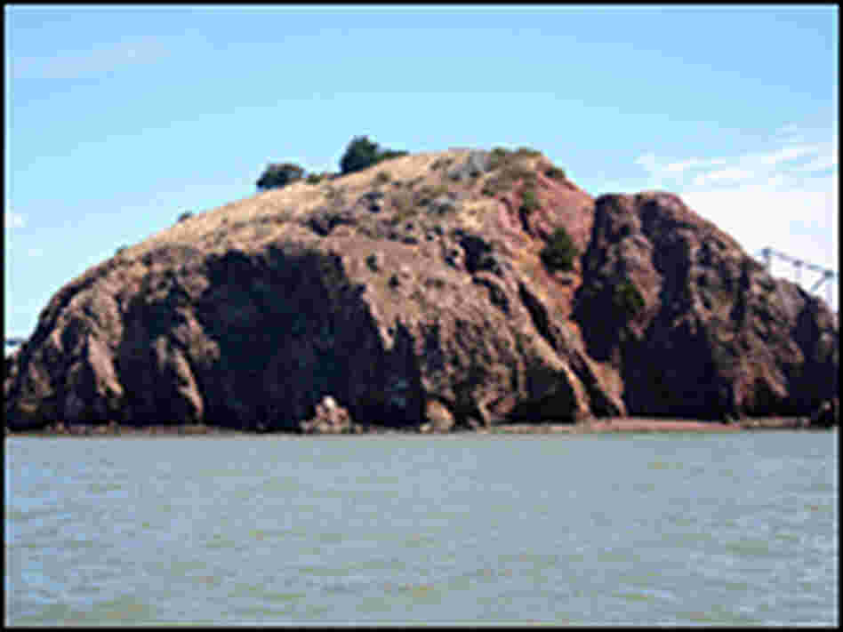 Red Rock Island is rich in manganese, the oxidized metal that gives it a red appearance.