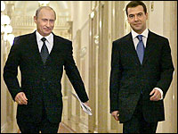 Russian President Vladimir Putin (left) and First Deputy Prime Minister Dmitry Medvedev are seen walking through a corridor at the Kremlin in this 2006 file photo.