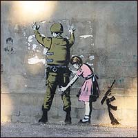 Along a main road leading out of Bethlehem, the British guerilla graffiti artist known as 