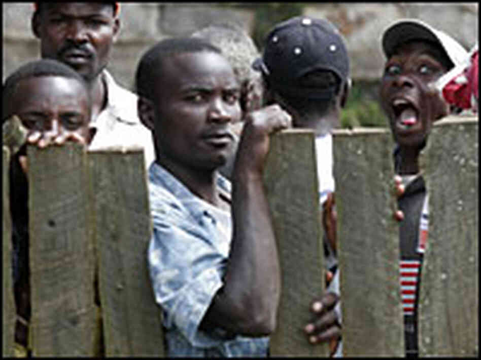 People watch during a visit from the European Union's chief election monitor in Molo, Kenya. People watch during a visit from the European Union's chief election monitor in Molo, Kenya.