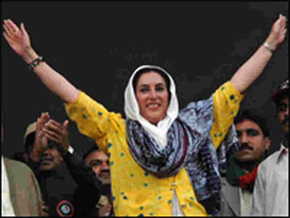 Bhutto waves to the crowd during an election campaign meeting.