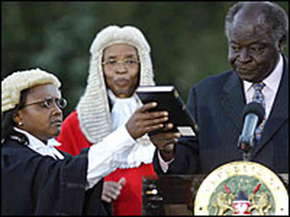 Newly re-elected Kenya President Mwai Kibaki (R) is sworn in for a second term on Sunday.
