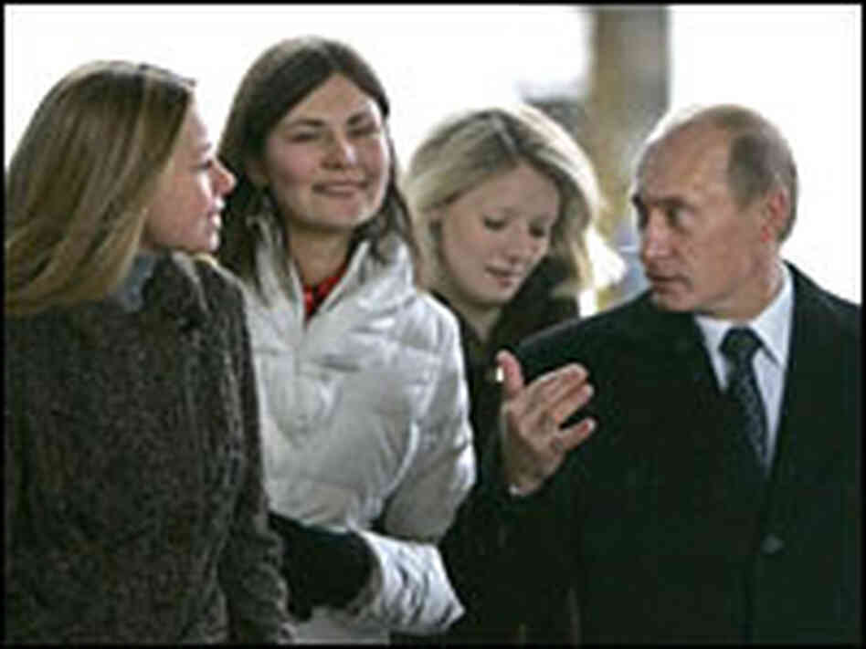Russian President Vladimir Putin talks with voters at a polling station in Moscow, Russia on Sunday.