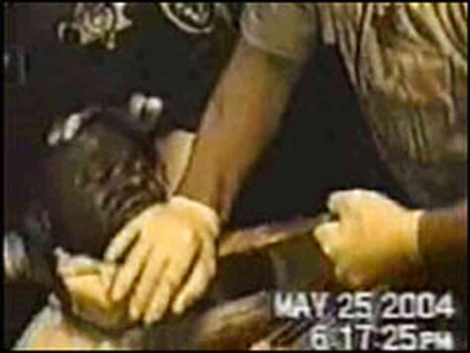 A still from a video shot by police shows efforts to revive Frederick Williams.