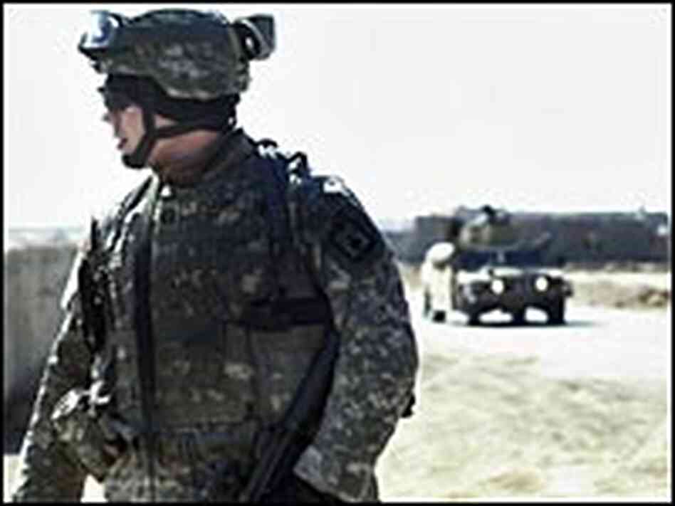 A U.S. soldier stands guard as U.S. military A U.S. soldier stands guard as U.S. military