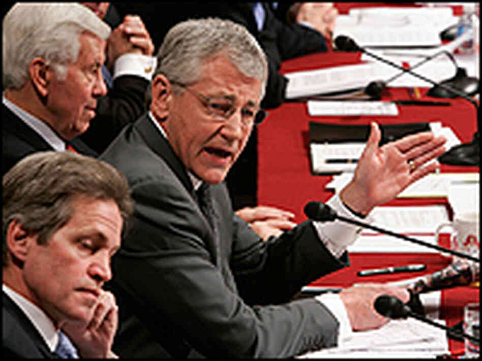 Sen. Chuck Hagel of Nebraska gestures with paper at Senate hearing.