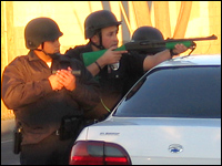 Police surround the home of a suspected gang member in the San Fernando Valley.