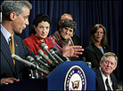 A bipartisan group of lawmakers at a news conference. A bipartisan group of lawmakers at a news conference.