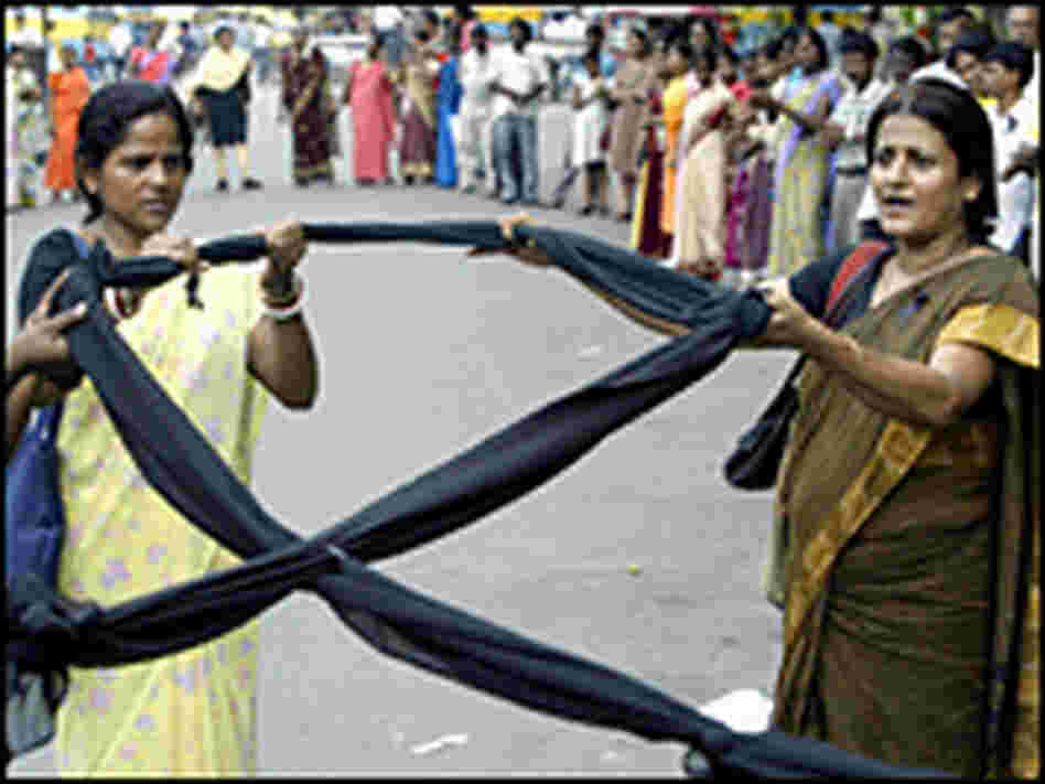 Indian activists hold a black ribbon as they take part in an HIV awareness rally in June.