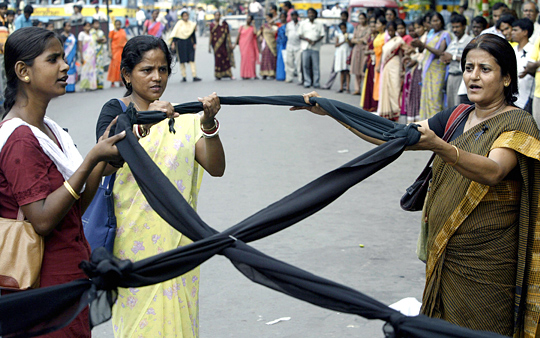 Indian activists hold a black ribbon as they take part in an HIV awareness rally in June.