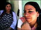 Roma, or gypsies, sit on the doorstep. Roma, or gypsies, sit on the doorstep.