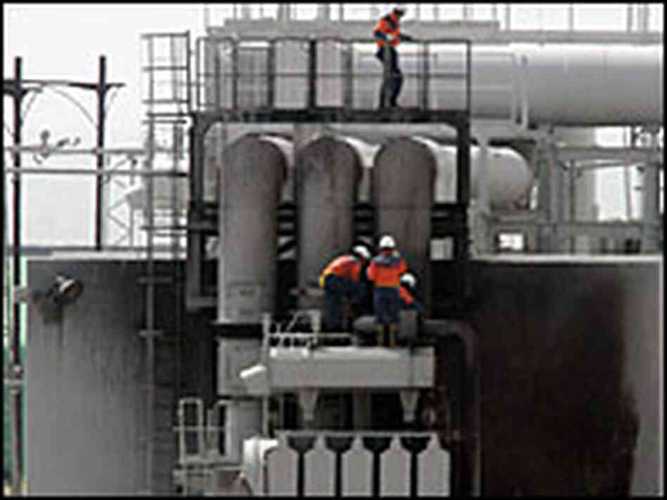 Fire department officers in Japan inspect a nuclear plant, which caught fire after a massive earthqu Fire department officers in Japan inspect a nuclear plant, which caught fire after a massive earthqu