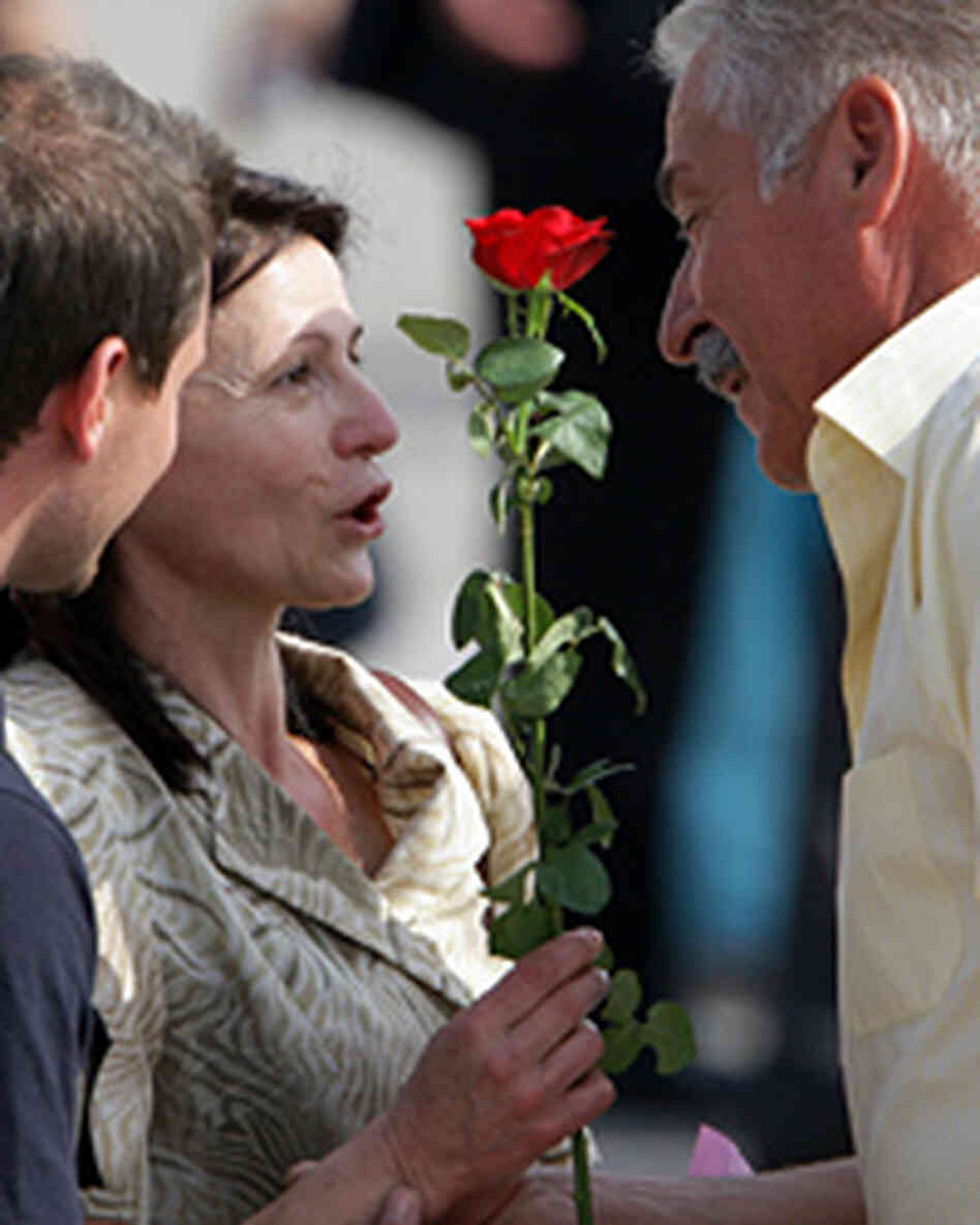 Bulgarian nurse Valentina Manolova Siropulo is offered a rose by an unidentified relative. Bulgarian nurse Valentina Manolova Siropulo is offered a rose by an unidentified relative.