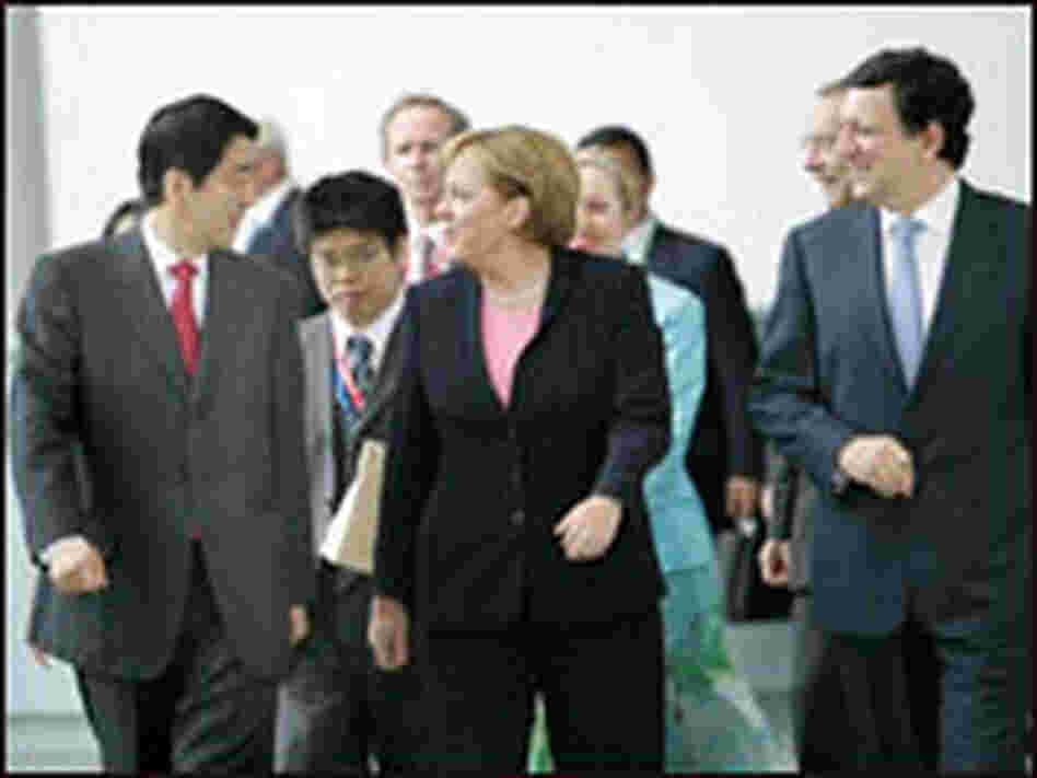 Japan's Prime Minister Shinzo Abe talks with German Chancellor Angela Merkel. Japan's Prime Minister Shinzo Abe talks with German Chancellor Angela Merkel.