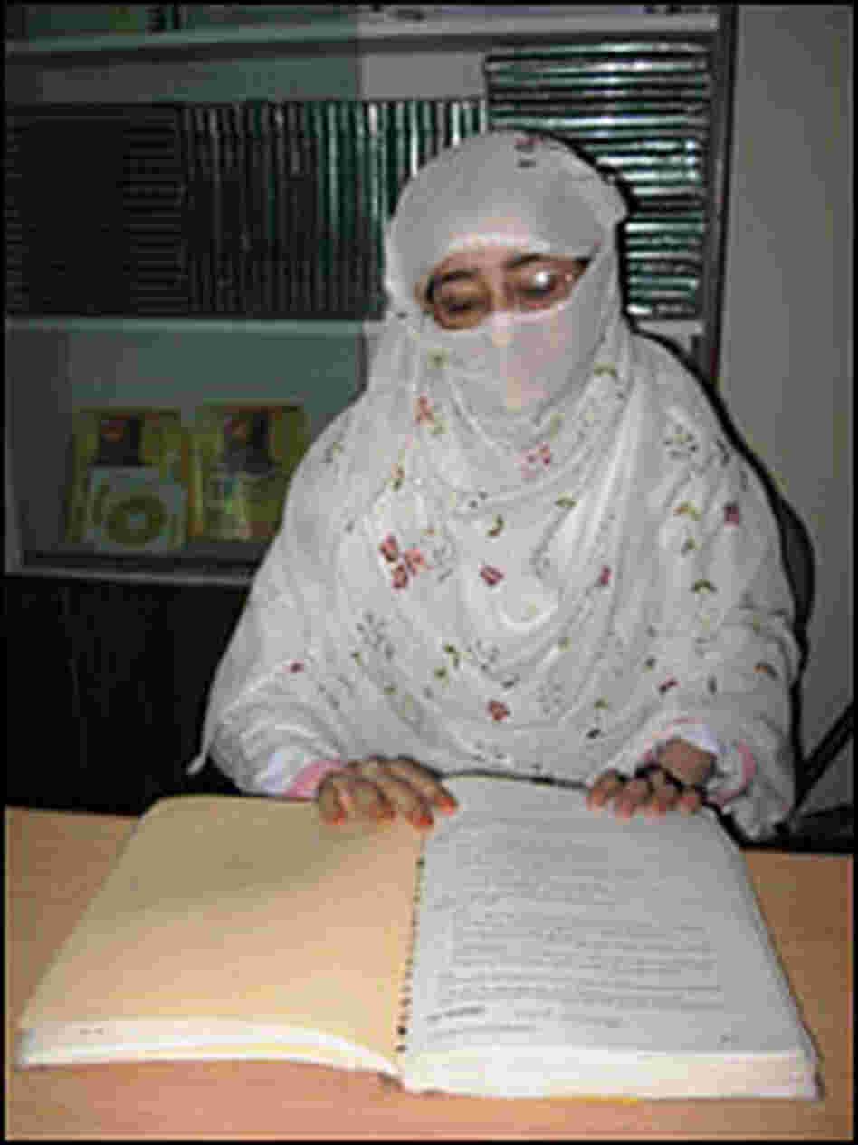 Midwife trainee Salima studies. Midwife trainee Salima studies.