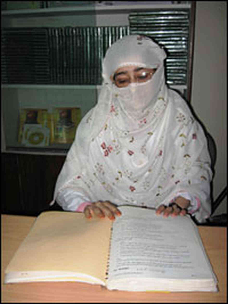 Midwife trainee Salima studies. Midwife trainee Salima studies.