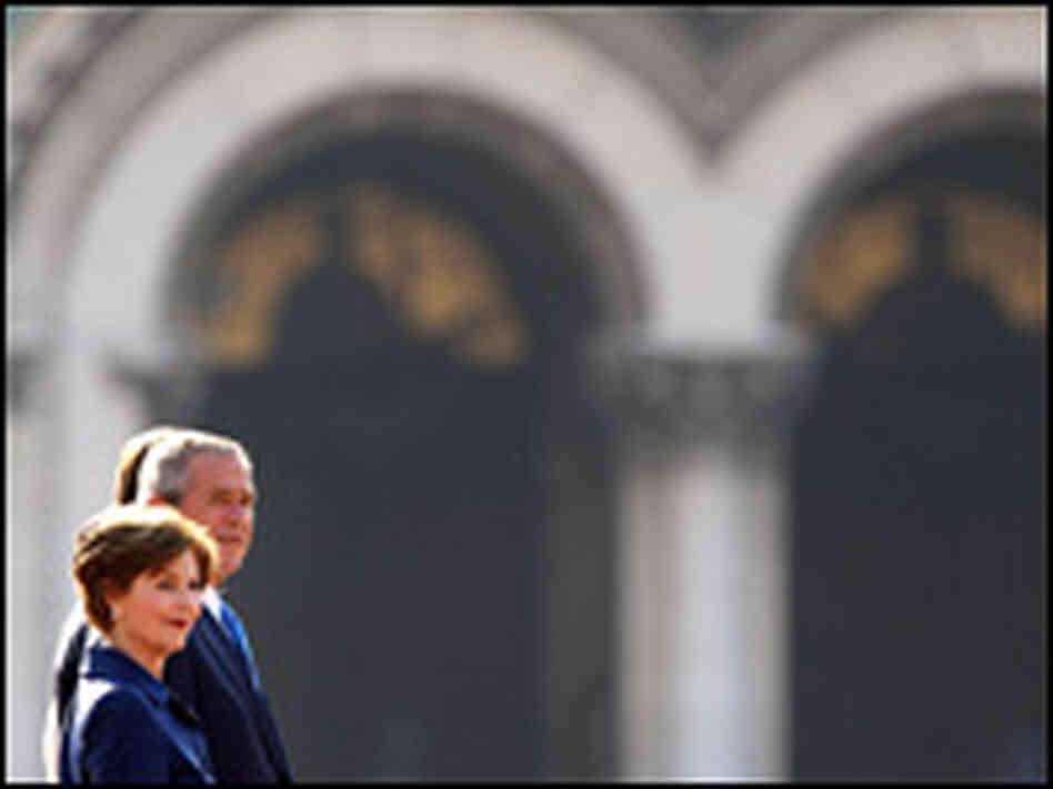 President Bush and wife Laura review a Bulgarian honor guard during an official welcoming ceremony. President Bush and wife Laura review a Bulgarian honor guard during an official welcoming ceremony.