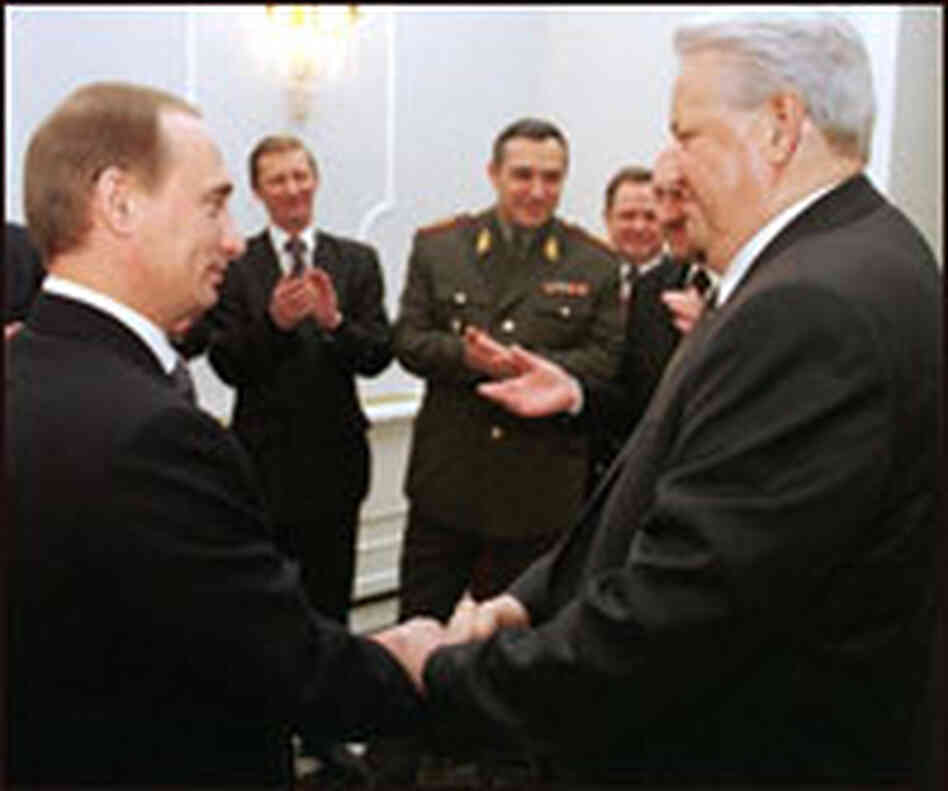 Outgoing Russian President Boris Yeltsin, right, shakes hands with Prime Minister Vladimir Putin. Outgoing Russian President Boris Yeltsin, right, shakes hands with Prime Minister Vladimir Putin.