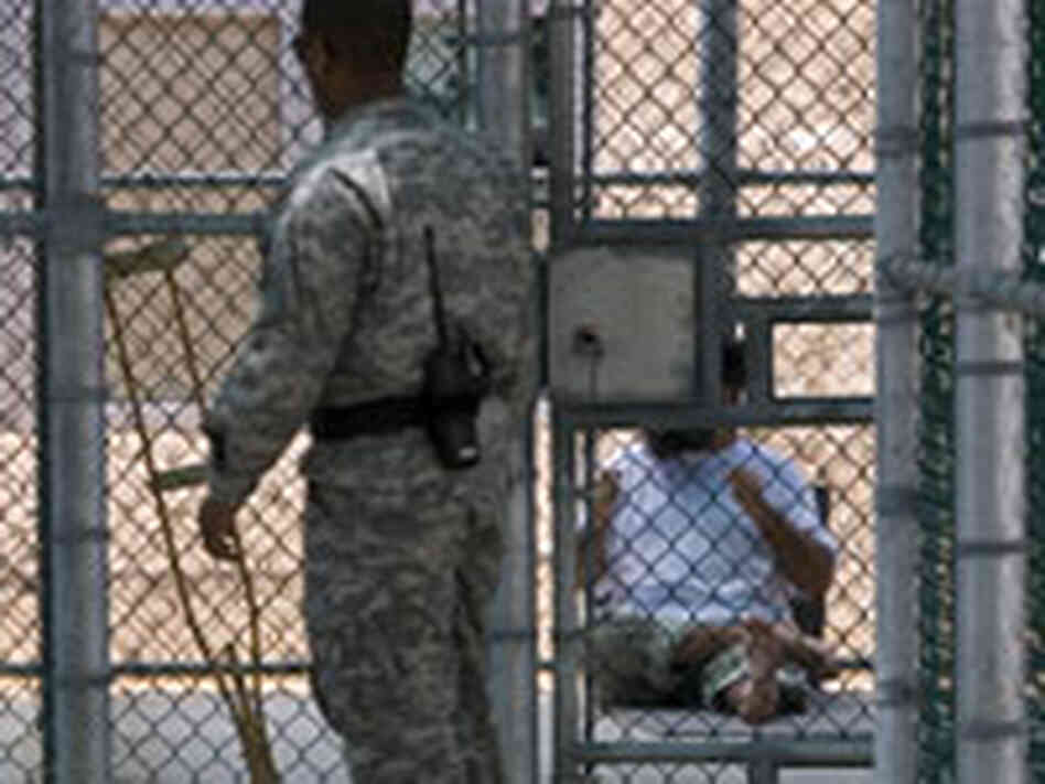 A guard checks on a detainee in a recreational area in Guantanamo Bay, Cuba A guard checks on a detainee in a recreational area in Guantanamo Bay, Cuba