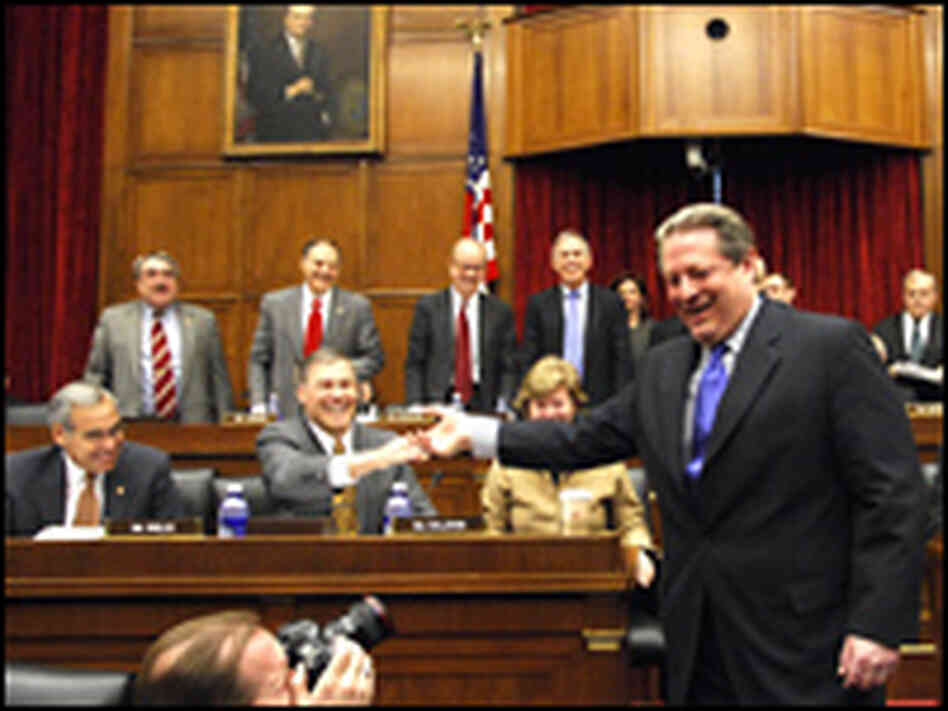 Former Vice President Al Gore greets members of a joint congressional hearing on climate change.