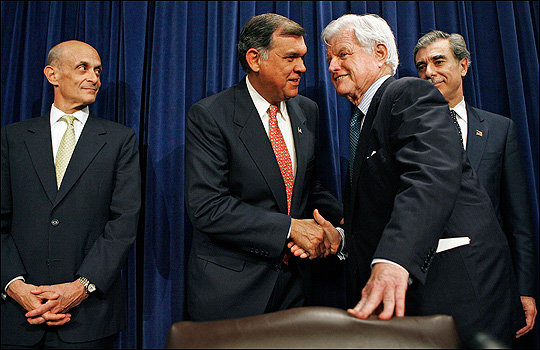 Sen. Mel Martinez and Sen. Ted Kennedy shake hands at a news conference on the immigration deal.