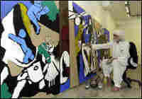 M.F. Husain creates a painting in 2003. M.F. Husain creates a painting in 2003.