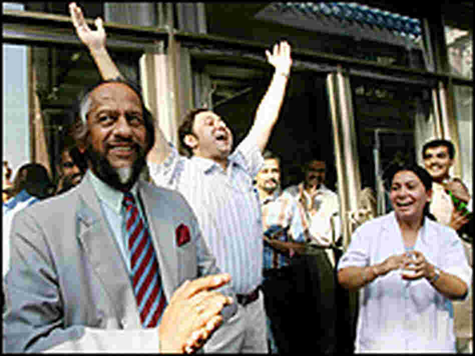 Rajendra Pachauri, chairman of the Intergovernmental Panel on Climate Change (IPCC), celebrates.