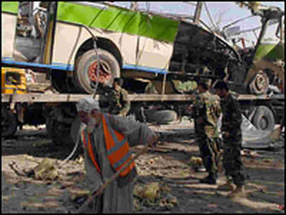 Municipal workers clean up after a suicide attack in Kabul, Afghanistan, earlier this month.