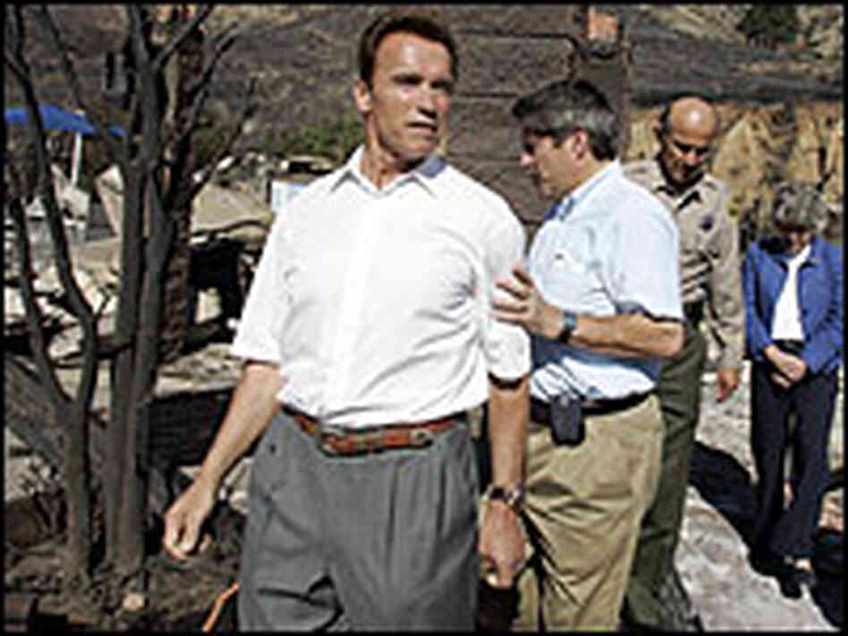 California Gov. Arnold Schwarzenegger tours fire-damaged Malibu, Calif.