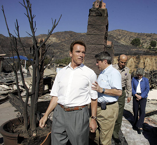 California Gov. Arnold Schwarzenegger tours fire-damaged Malibu, Calif.