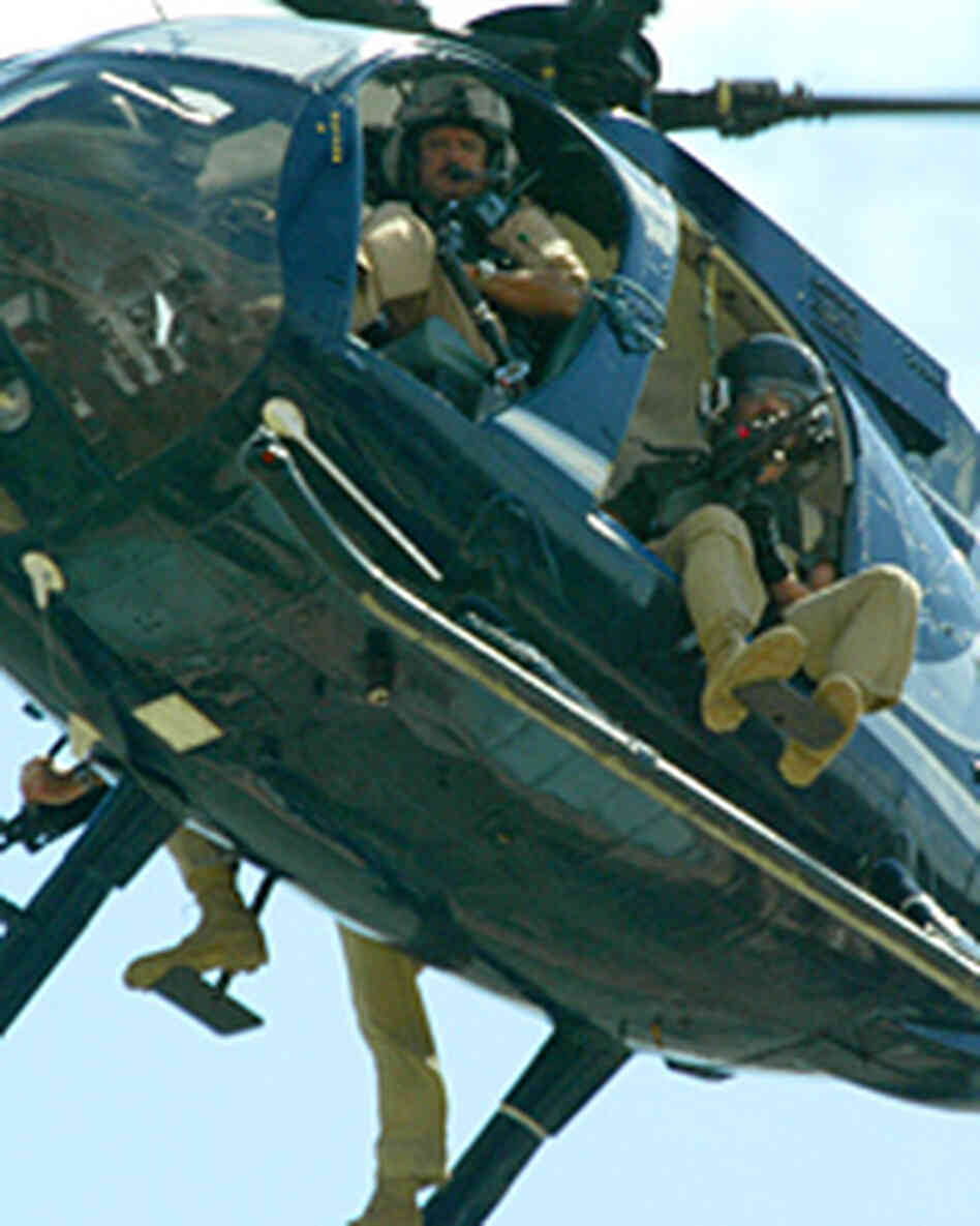 A file photo shows a Blackwater helicopter patrol over Baghdad in 2004. (Patrick Baz/AFP/Getty Image
