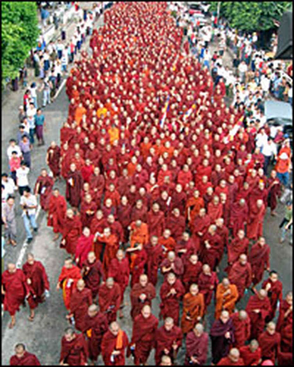Buddhist monks march on a street in protest against the military government in Yangon, Myanmar. Buddhist monks march on a street in protest against the military government in Yangon, Myanmar.