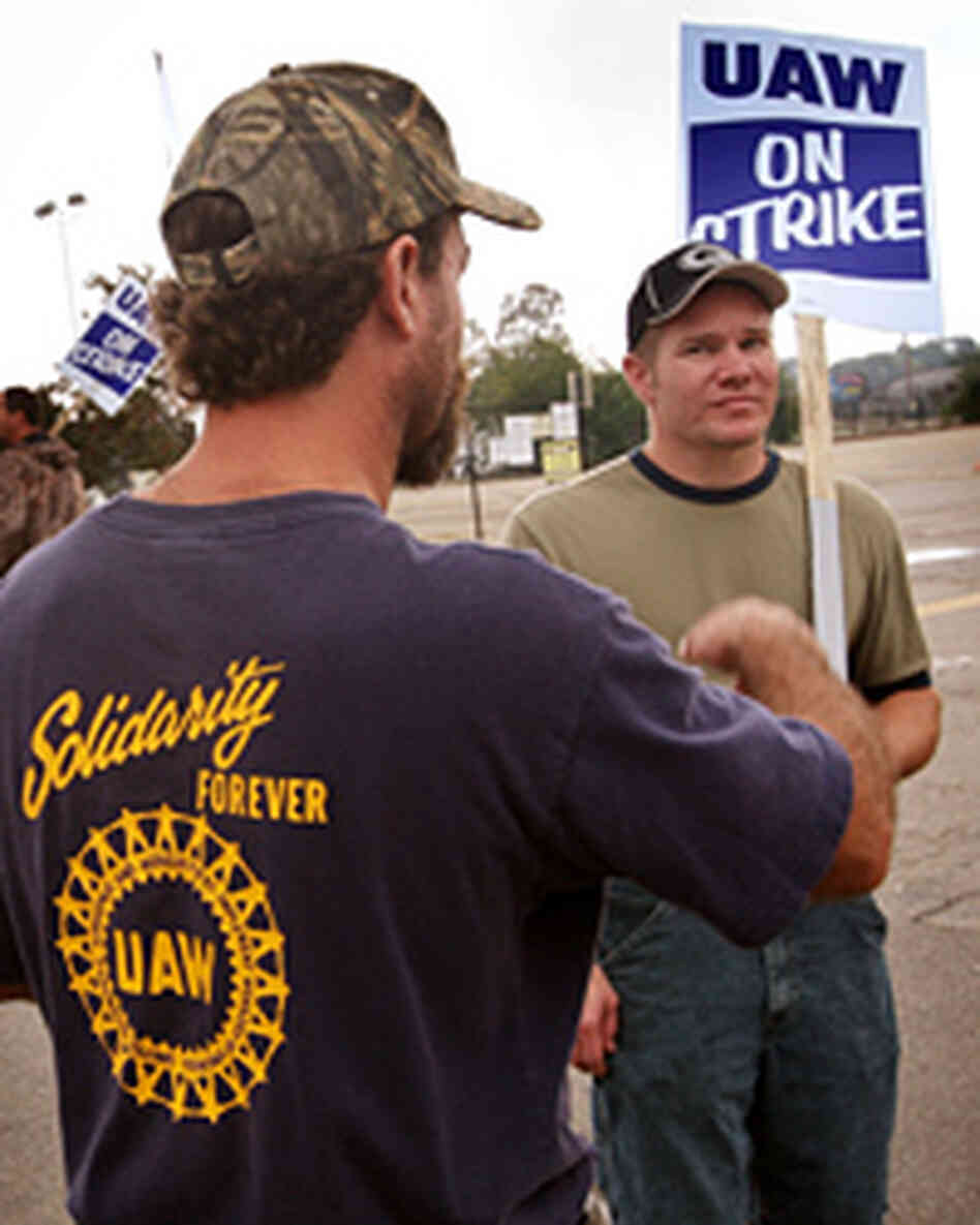 United Auto Workers members picket outside General Motors' assembly plant in Wisconsin. United Auto Workers members picket outside General Motors' assembly plant in Wisconsin.