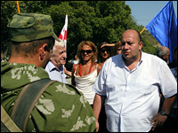 A Georgian protester confronts a Russian army officer at a checkpoint near Tbilisi.