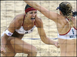 Americans Misty May-Treanor (left) and Kerri Walsh celebrate their Olympic gold medal victory over China's Tian Jia and Wang Jie in women's beach volleyball in Beijing.