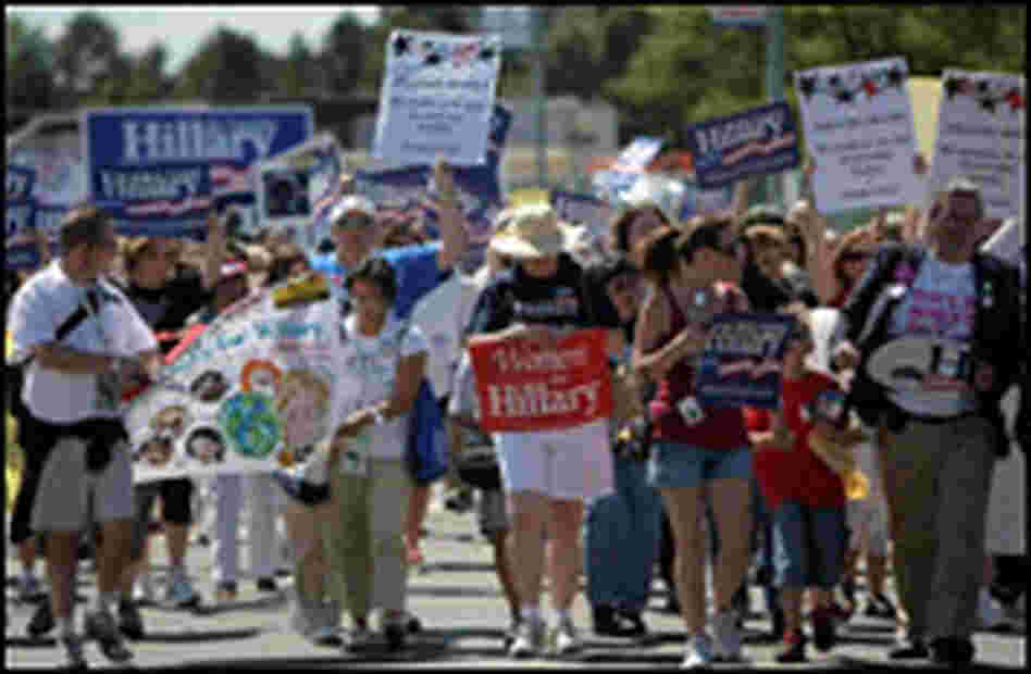 Clinton supporters march to the Pepsi Center in Denver.