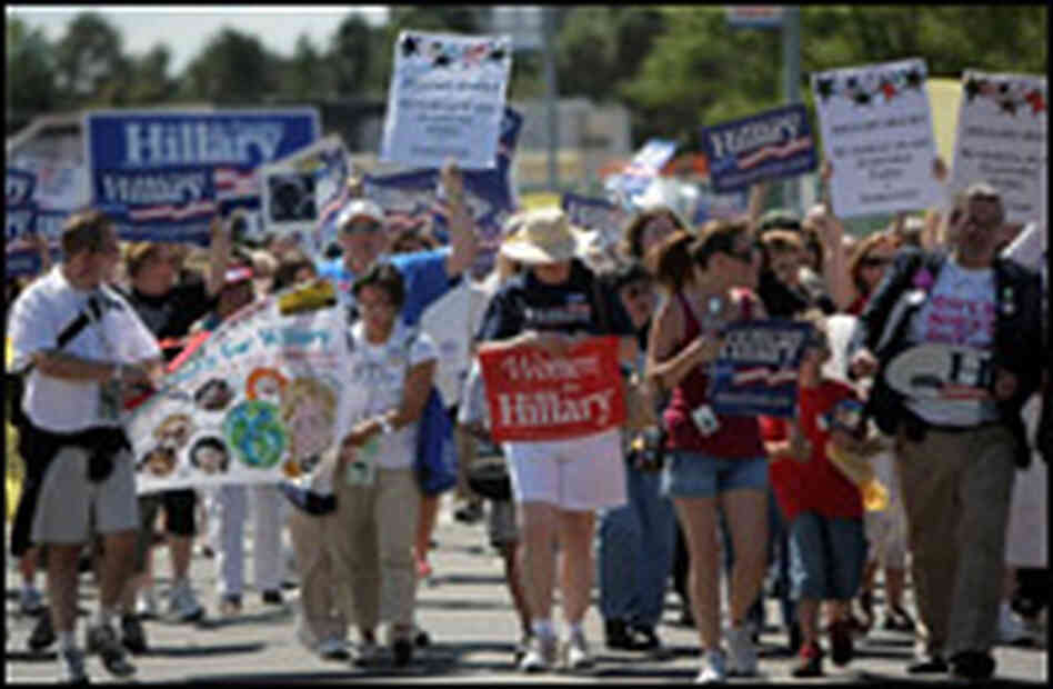 Clinton supporters march to the Pepsi Center in Denver.