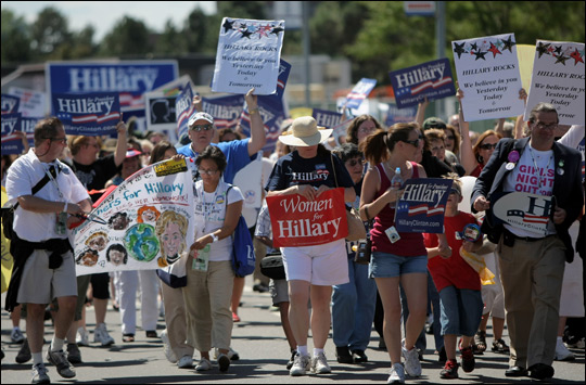 Clinton supporters march to the Pepsi Center in Denver.
