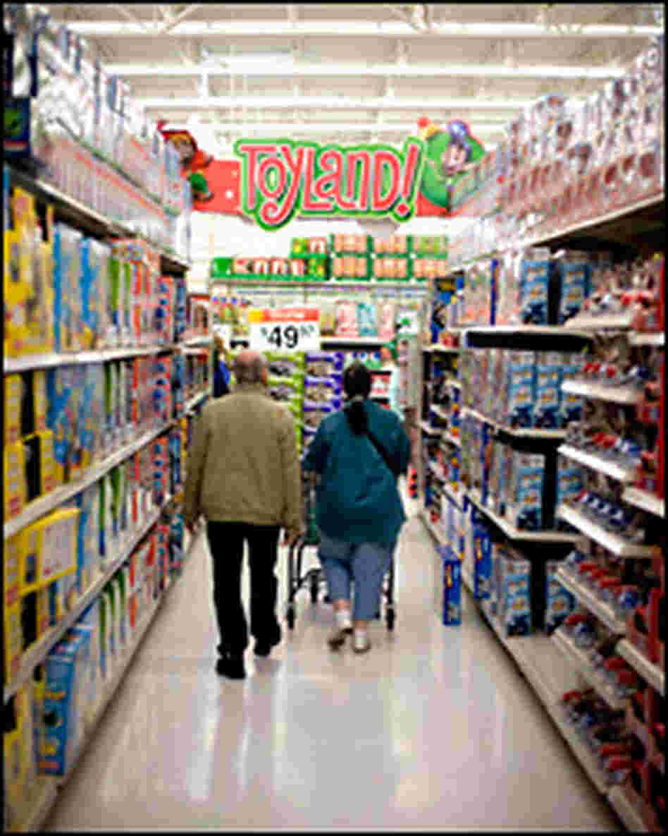Holiday shoppers walk the aisles of the toy section in a store in New Jersey. Holiday shoppers walk the aisles of the toy section in a store in New Jersey.
