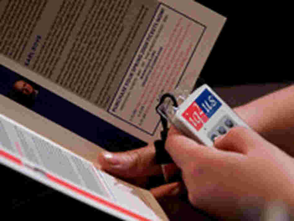 An audience member votes on the proposition at the debate.