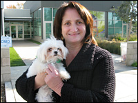 Debbie Garringer of Claremont, Calif., holds one of the two dogs she won at the auction.