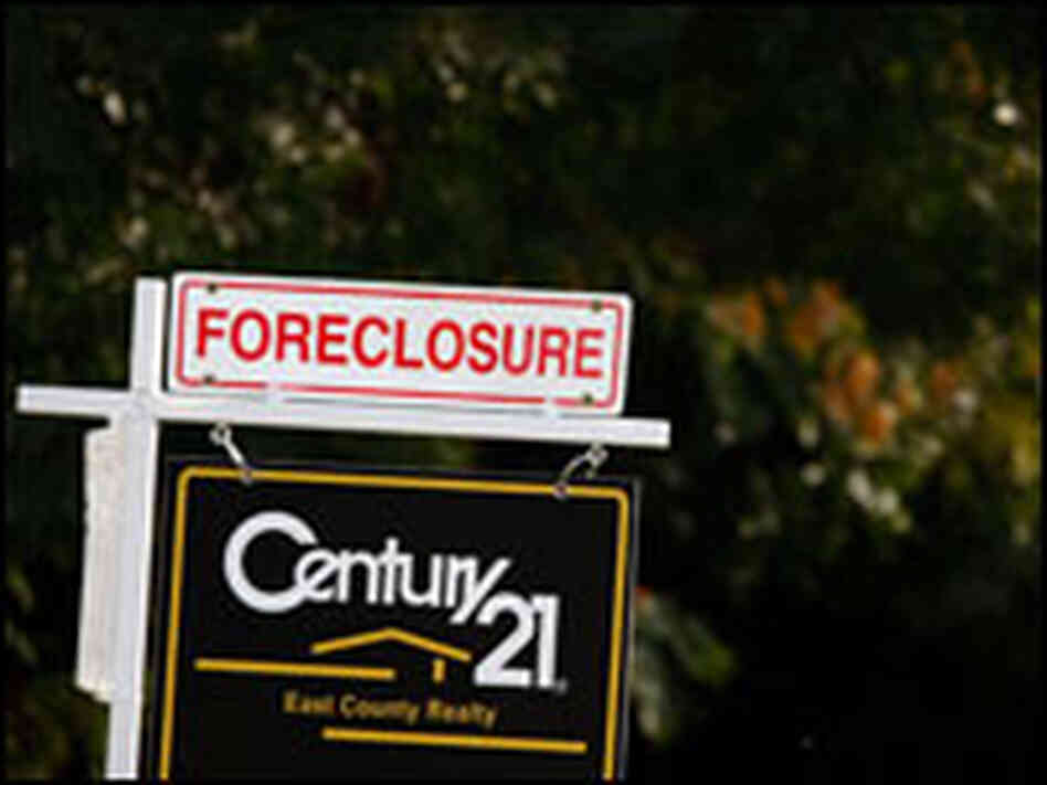 A sign reading foreclosed sits on top of a For Sale sign outside a home in Antioch, Calif. A sign reading foreclosed sits on top of a For Sale sign outside a home in Antioch, Calif.