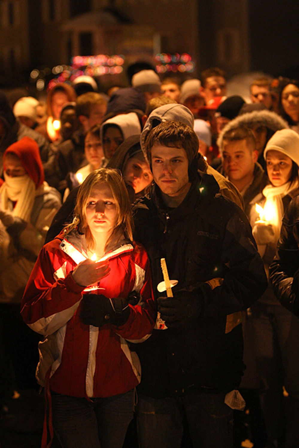 Students gather for a prayer service on the campus of Northern Illinois University to pray for those