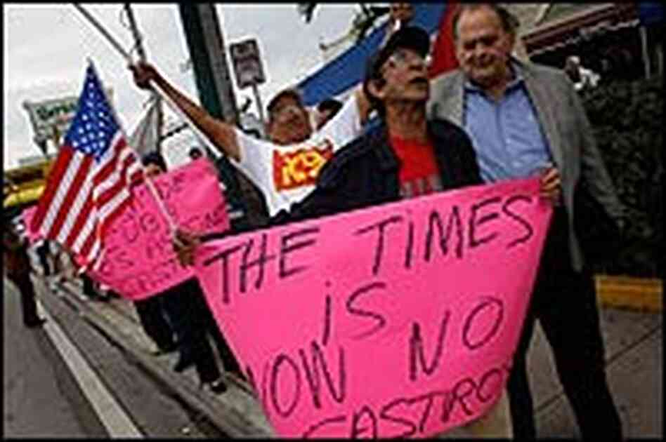 Oscar Gala holds a sign Oscar Gala holds a sign
